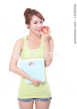 Beautiful slim woman with scales and apple 11680082