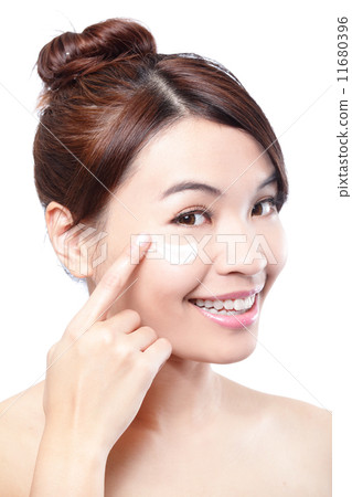 Beauty young woman applying cosmetic cream 11680396