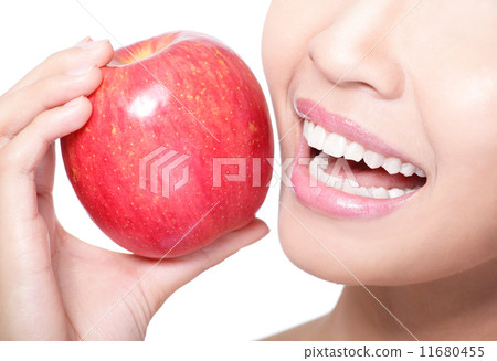 young woman eating red apple with health teeth 11680455