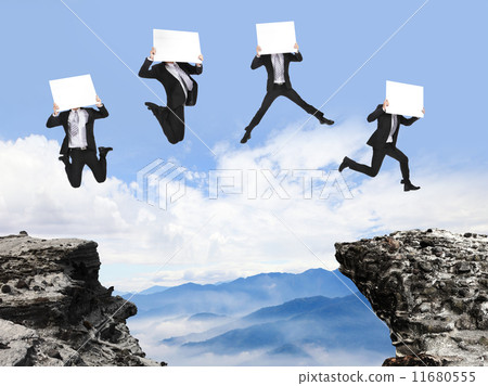 businessman jumping with billboard on the mountain businessman jumping with billboard on the mountain 11680555