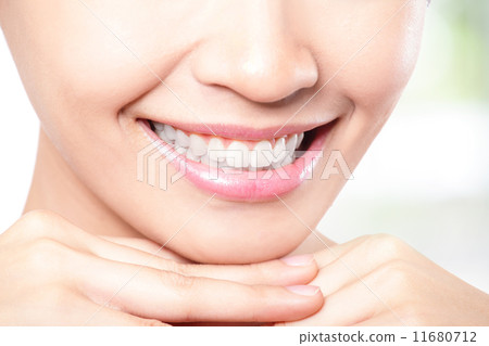 Beautiful young woman teeth close up 11680712