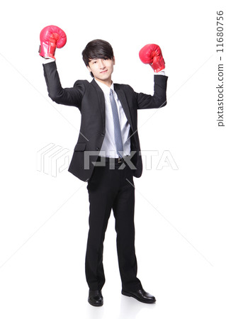 Businessman win pose with boxing gloves 11680756