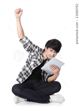 young man happy using tablet pc 11680762
