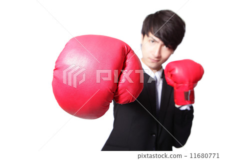 Business man fighting with boxing gloves 11680771