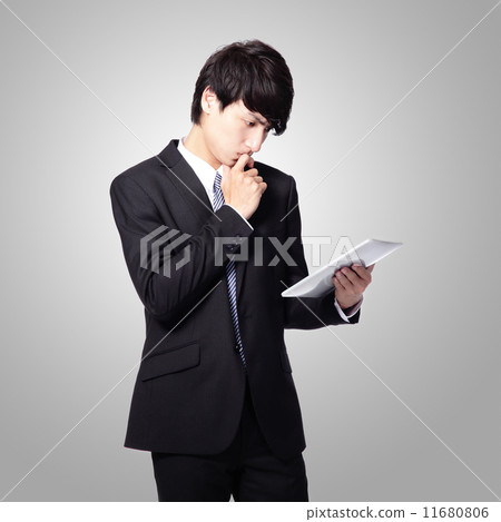 business man reading news on tablet pad business man reading news on tablet pad 11680806