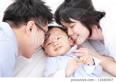 Happy family with children in bed Happy family with children in bed 11680807