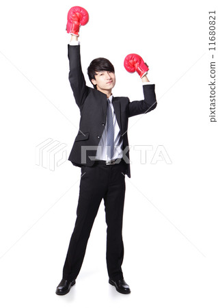 Businessman win pose with boxing gloves 11680821