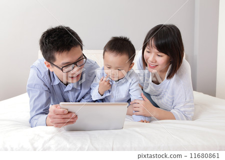 happy family using tablet pc happy family using tablet pc 11680861