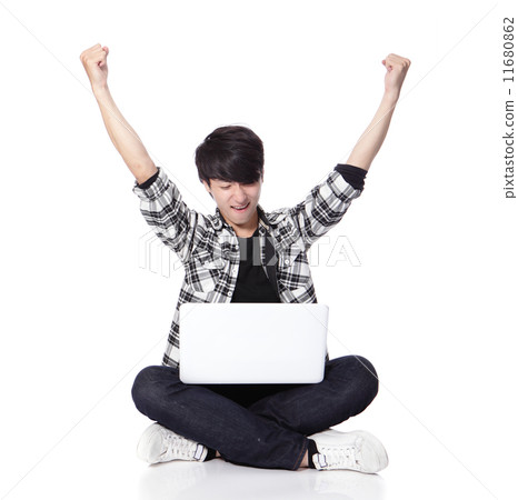 student Man sitting and using computer student Man sitting and using computer 11680862