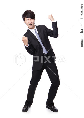 handsome business man with arms raised in success 11680864