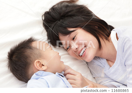 Mother and son smile and look each other Mother and son smile and look each other 11680865
