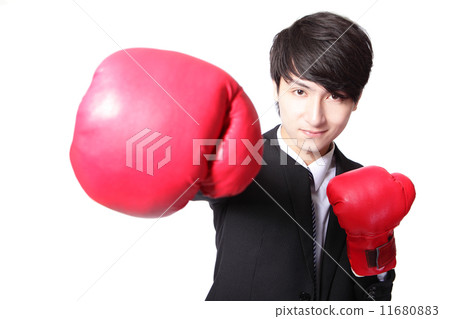 Business man fighting with boxing gloves 11680883