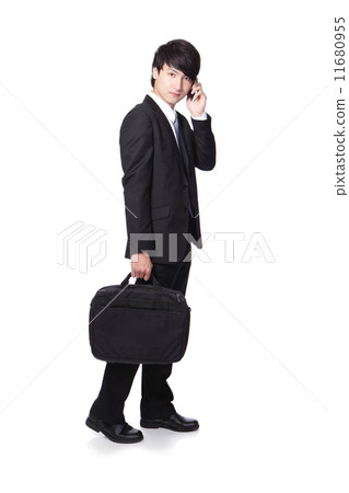 Business man Walking while speaking mobile phon 11680955