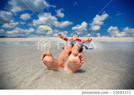Little boy on exotic beach vacation 11693171