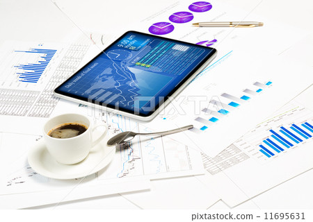 tablet, financial documents and a cup of coffee tablet, financial documents and a cup of coffee 11695631