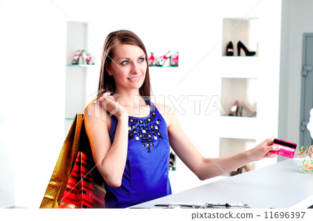 woman at shopping checkout paying credit card woman at shopping checkout paying credit card 11696397