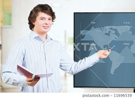 young business man shows on the monitor charts young business man shows on the monitor charts 11696539