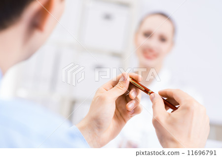 close-up, hands holding pen close-up, hands holding pen 11696791