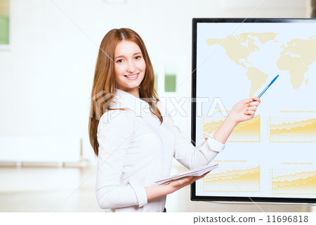 young business woman shows map of world young business woman shows map of world 11696818