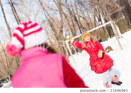 Children in Winter Park playing snowballs Children in Winter Park playing snowballs 11696965