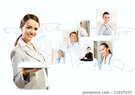 attractive woman holding a tablet pc and smiling attractive woman holding a tablet pc and smiling 11697033