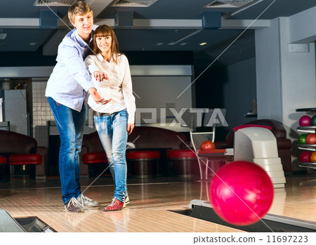 young couple plays bowling 11697223