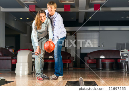 young couple plays bowling young couple plays bowling 11697263