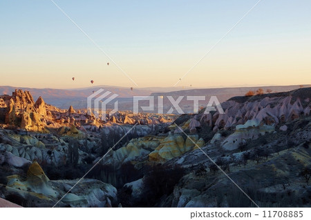 Turkey · Cappadocia A rocky group shining in the morning sun and a balloon Turkey · Cappadocia A rocky group shining in the morning sun and a balloon 11708885