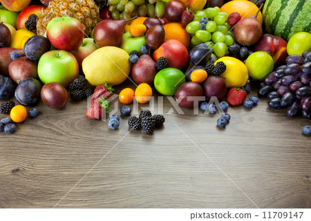 Big assortment of Fresh Organic Fruits, frame composition on woo 11709147