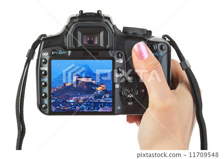 Camera in hand and winter Austria view Camera in hand and winter Austria view 11709548
