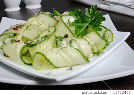 Salad from fresh cucumbers with garlic, dill, spices Salad from fresh cucumbers with garlic, dill, spices 11712402