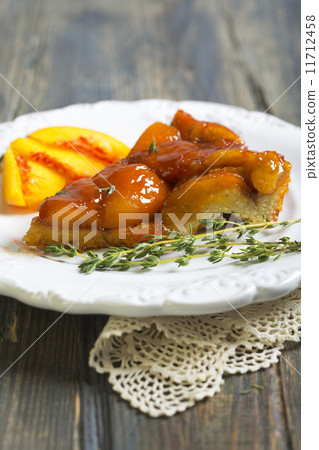 Plate with peach pie and thyme. 11712458