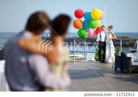 Happy bride and groom with balloons Happy bride and groom with balloons 11712911