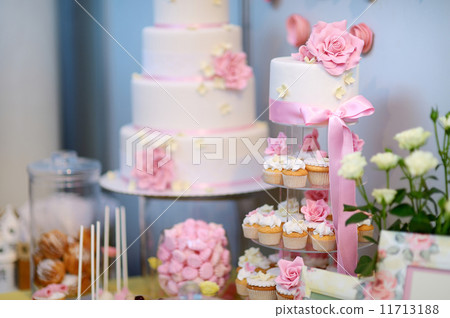 White wedding cupkace cake decorated with flowers 11713188
