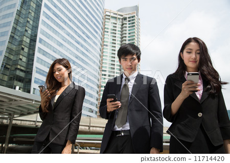 Asian people used cellphone for communicate to customer Asian people used cellphone for communicate to customer 11714420