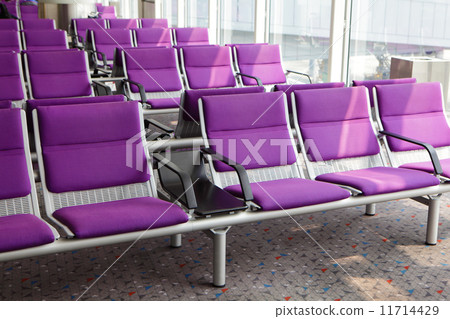row of purple chair at airport 11714429
