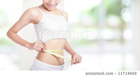 Woman smile measuring shape of waist Woman smile measuring shape of waist 11714608