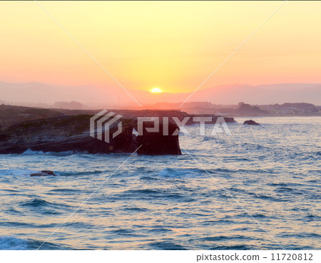 Beautiful sunset and stone arches on Playa de las Catedrales 11720812