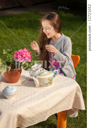 girl having breakfast at yard and laughing loud girl having breakfast at yard and laughing loud 11721052
