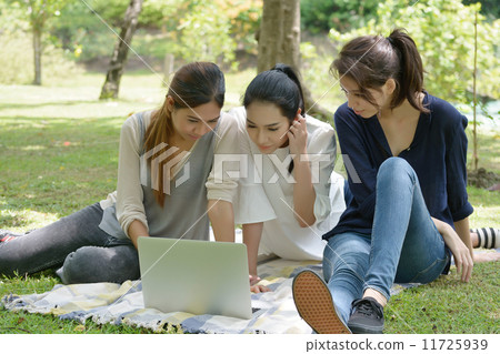 three young asian woman 11725939