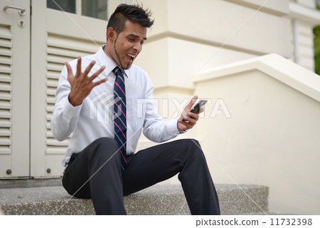 Businessman using phone 11732398
