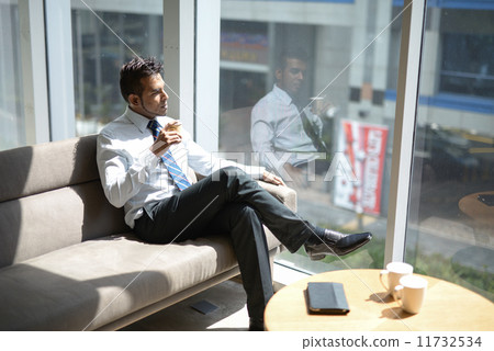 Businessman in office Businessman in office 11732534