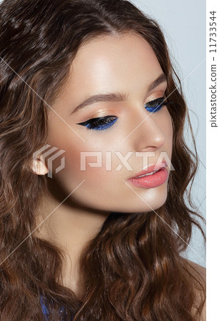 Visage. Pensive Woman with Blue Mascara and Holiday Makeup Visage. Pensive Woman with Blue Mascara and Holiday Makeup 11733544