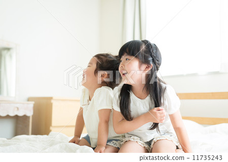 Sister on the bed 11735243