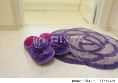 Close-up image of the house - Cute slippers and bath mats in the washroom 11735586