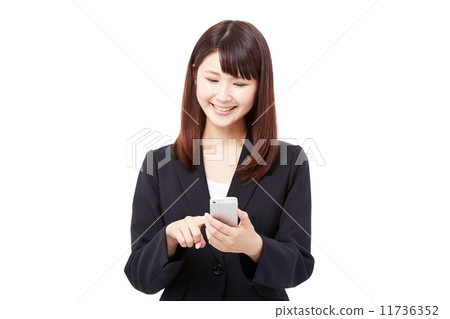 Business woman operating a smartphone 11736352