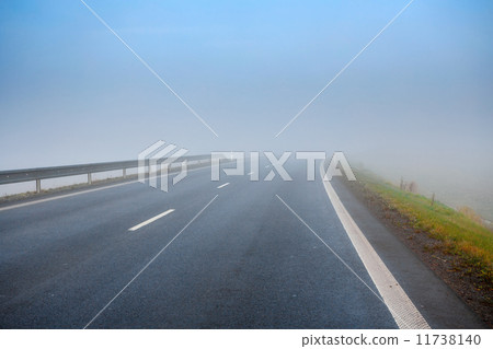 Road going in to the fog 11738140