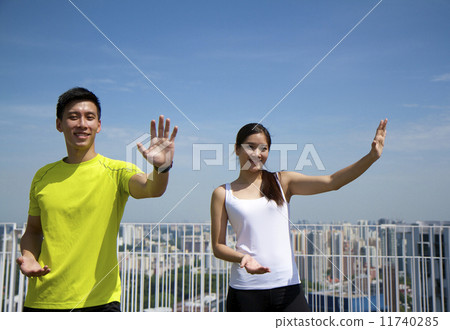 Young Asian Adults doing Taichi in the city Young Asian Adults doing Taichi in the city 11740285