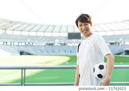 A man with a soccer ball A man with a soccer ball 11742023