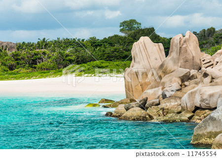 tropical turquoise sea with granite boulders 11745554